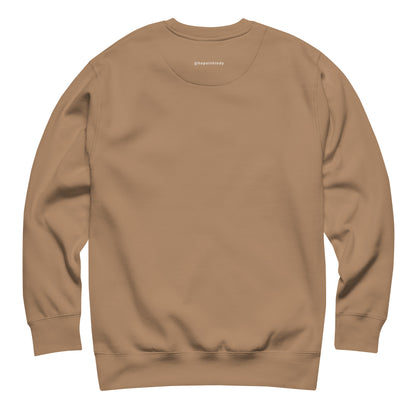 Back of the latte HOPE sweatshirt with the @hopeinhindy label printed on the outside label